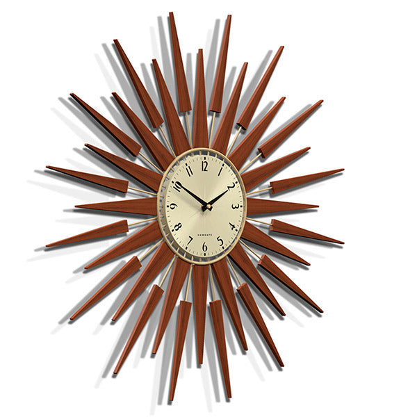 Skewed view of the Pluto sunburst style wall clock by Newgate World with dark wood rays and a gold metal Arabic dial